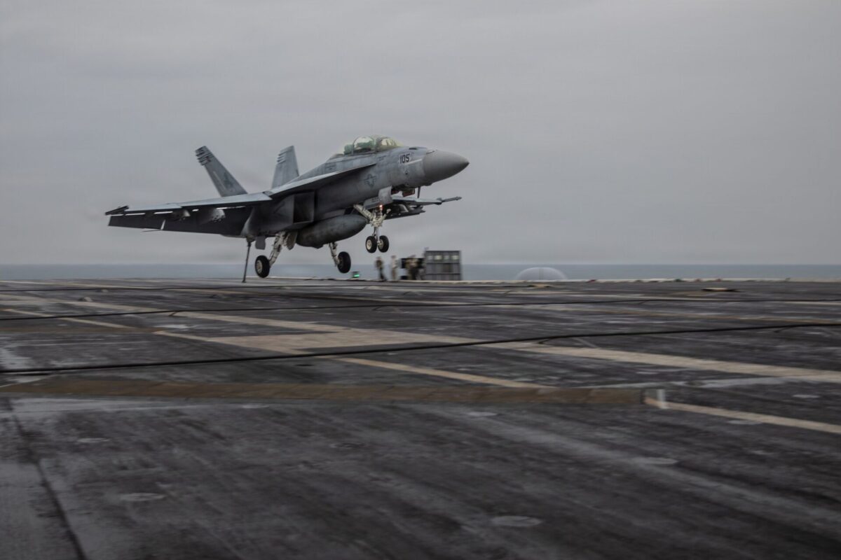 An FA 18F Super Hornet approaches the flight deck of Nimitz class aircraft carrier USS Dwight D Eisenhower An FA 18F Super Hornet approaches the flight deck of Nimitz class aircraft carrier USS Dwight D Eisenhower