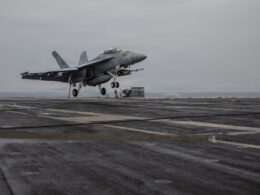 An FA 18F Super Hornet approaches the flight deck of Nimitz class aircraft carrier USS Dwight D Eisenhower
