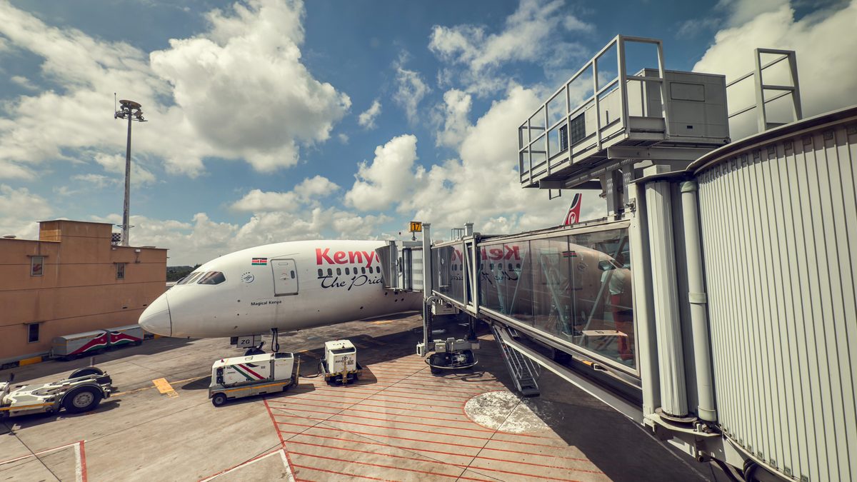 NairobiKenya28 10 2025KenyaAirwaysBoeing787AtTheGate Kenya Airways aircraft at a gate connected to a jet bridge under a blue sky with clouds