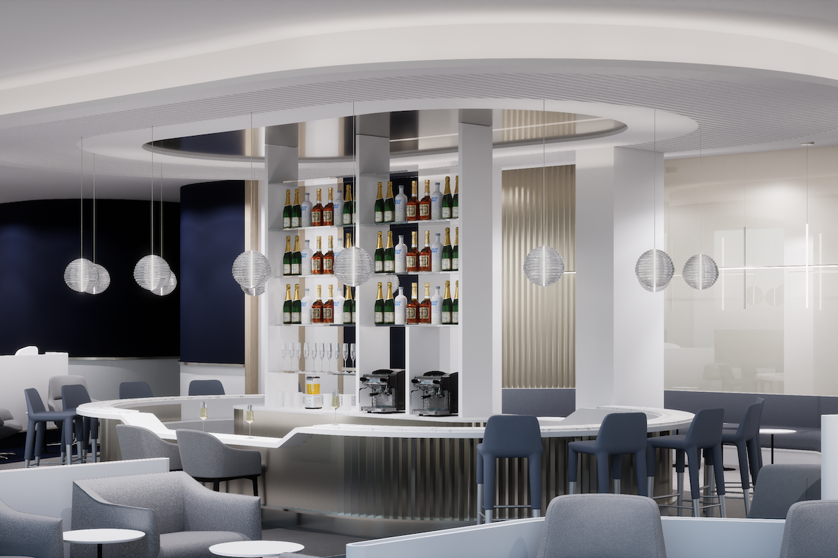 MARKS AF BAR 1920x1080 Modern circular bar with backlit shelves displaying bottles surrounded by grey seating in a sleek lounge