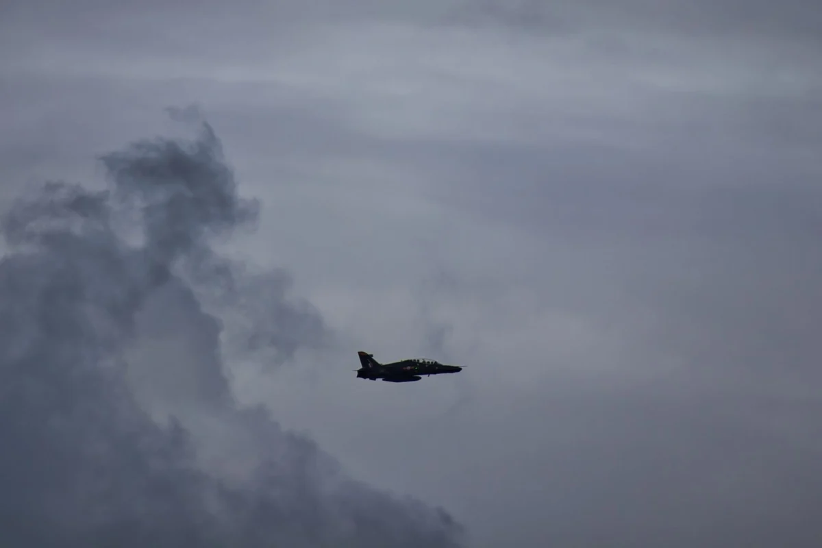 RAF BAE Systems Hawk T2 advanced jet training aircraft against moody grey clouds and sky RAF BAE Systems Hawk T2 advanced jet training aircraft against moody grey clouds and sky