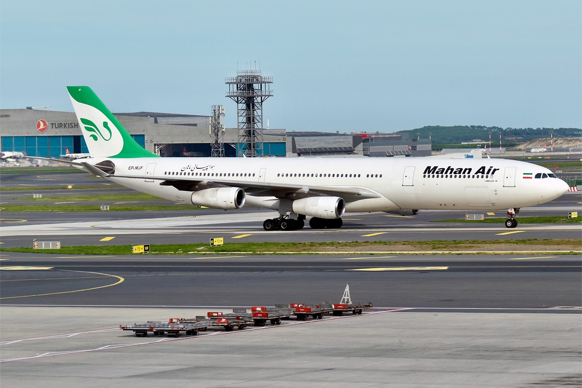 Mahan Air Airbus A340 taxiing on a runway at the airport with the green tailed logo visible on the fuselage