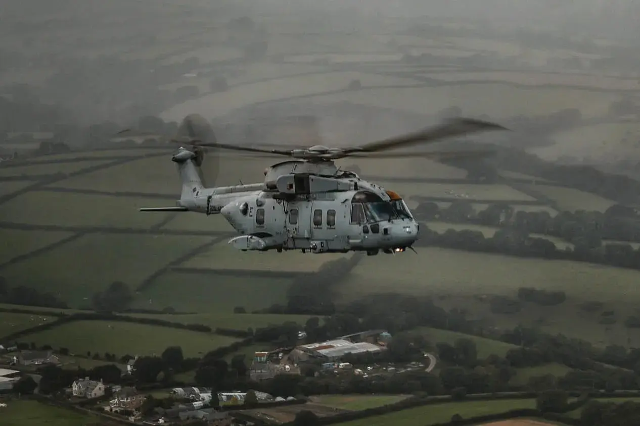 Royal Navy Merlin HC4 helicopter operating from the flight deck of HMS Queen Elizabeth