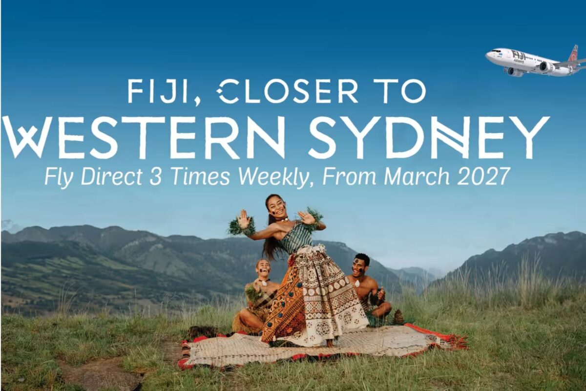 Fiji Airways launches direct flights to Western Sydney Promotional Fiji banner showing dancers in traditional dress in a field with bold white text FIJI CLOSER TO WESTERN SYDNEY and Fly Direct 3 Times Weekly From March 2027 and a plane in the sky