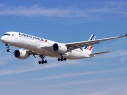 Air France passenger jet taking off with landing gear down against a clear blue sky wings and engines visible karşı