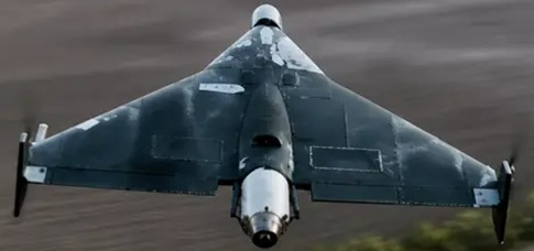 A Russian Geran 4 jet powered attack drone Front on view of a dark stealth aircraft with wide triangular wings flying low toward the camera over terrain nose cone visible