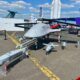 An LBA Systems branded Bayraktar TB3 displayed alongside Turkish made munitions at the Paris Air Show in June 2025