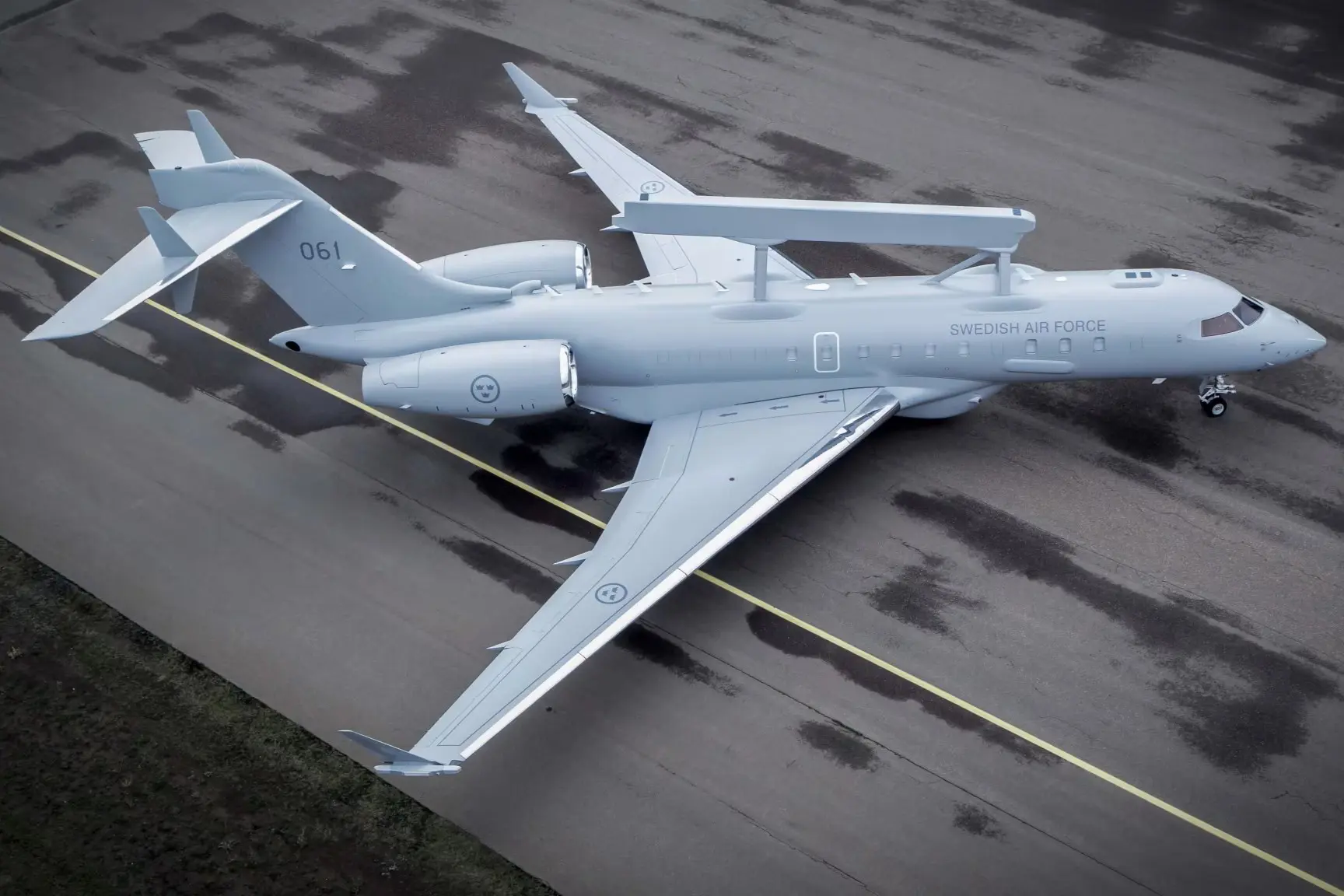An overhead view of the Swedish Air Forces first S 106 GlobalEye serial 061 showing the Erieye Extended Range radar mounted above the Bombardier Global 6000 fuselage