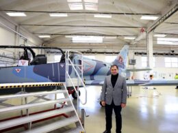 Armenian Defense Minister Suren Papikyan poses beside an Aero L 39 Skyfox jet bearing Armenian Air Force markings during a visit to Aero Vodochodys factory