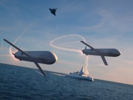 MBDA Remote Carrier Compact drones are depicted operating alongside a frigate and combat aircraft