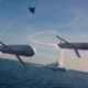 MBDA Remote Carrier Compact drones are depicted operating alongside a frigate and combat aircraft
