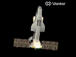 Space shuttle in ascent with bright exhaust flames against the black of space viewed from behindWings and tail clearly visible