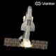 Space shuttle in ascent with bright exhaust flames against the black of space viewed from behindWings and tail clearly visible