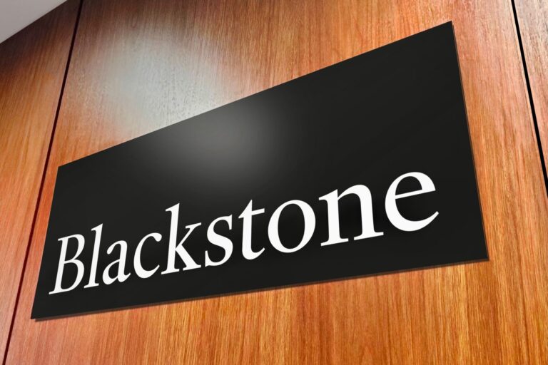 Recently Saved 1 of 1 31 Tilted black sign on a wooden surface displaying the white word Blackstone in serif letters close up