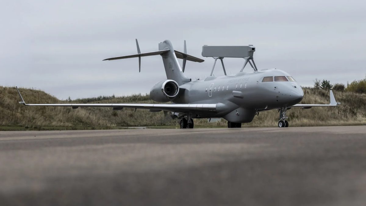 Swedens first Saab S 106 GlobalEye airborne early warning and control aircraft following its rollout at Saabs Linköping facility Gray private jet parked on a runway with a grassy field in the background