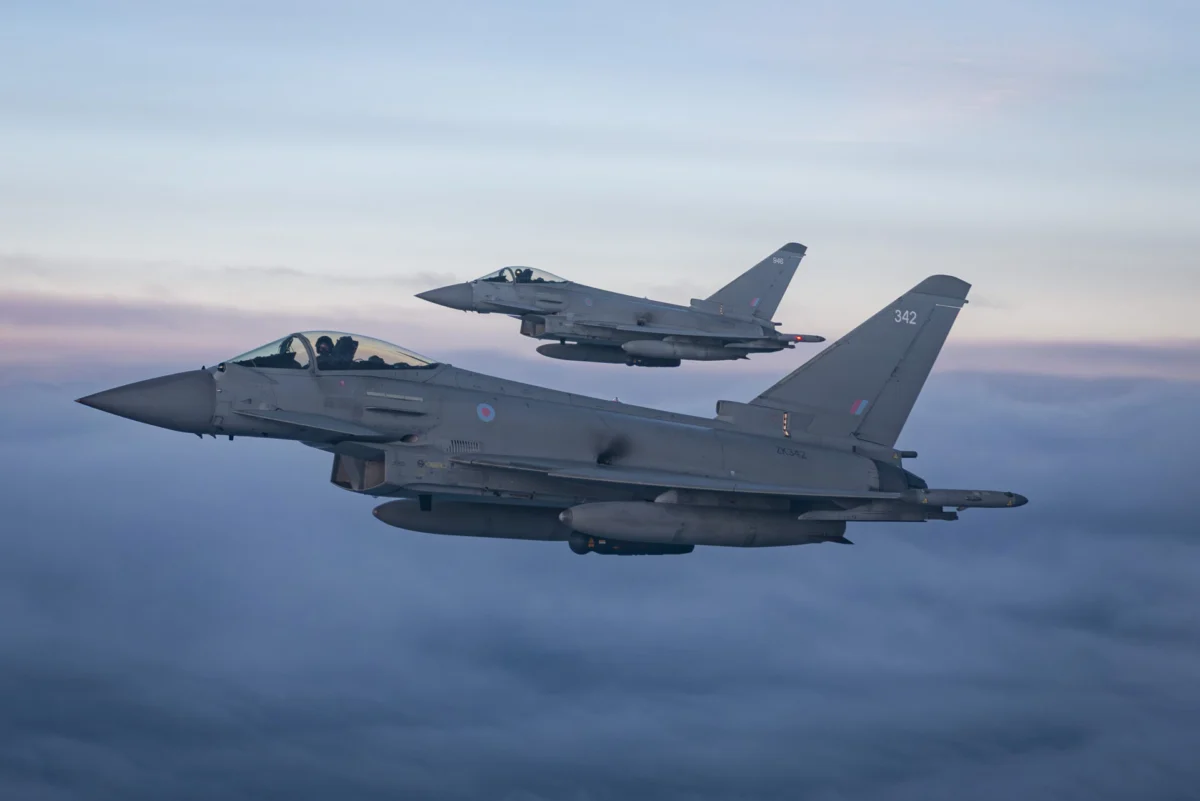 Two Royal Air Force Typhoon fighter jets fly in formation during a NATO training exercise Two Royal Air Force Typhoon fighter jets fly in formation during a NATO training exercise