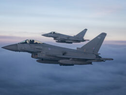 Two Royal Air Force Typhoon fighter jets fly in formation during a NATO training exercise