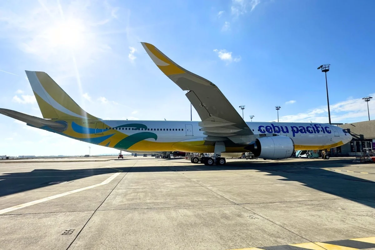 Cebu Pacific receives 15th A330neo first widebody of 2026 Cebu Pacific jet on the tarmac with a colorful yellow and blue tail under a bright sunny sky