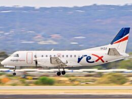 Regional Express airplane taking off on runway full view of fuselage and bluered tail livery VH ZLR