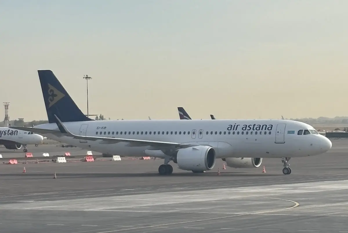 air astana a320 Air Astana passenger jet taxiing on the tarmac at an airport blue tail logo visible