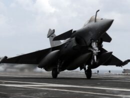 A French Dassault Rafale fighter aircraft conducts touch and go landings aboard the aircraft carrier USS Dwight D Eisenhower