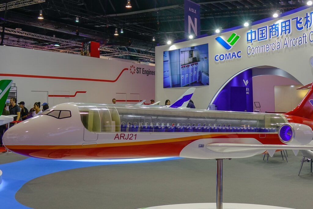 A cutout display of the COMAC ARJ21 at the Singapore Airshow COMAC ARJ21 made its commercial debut in Indonesia with TransNusa a local airline