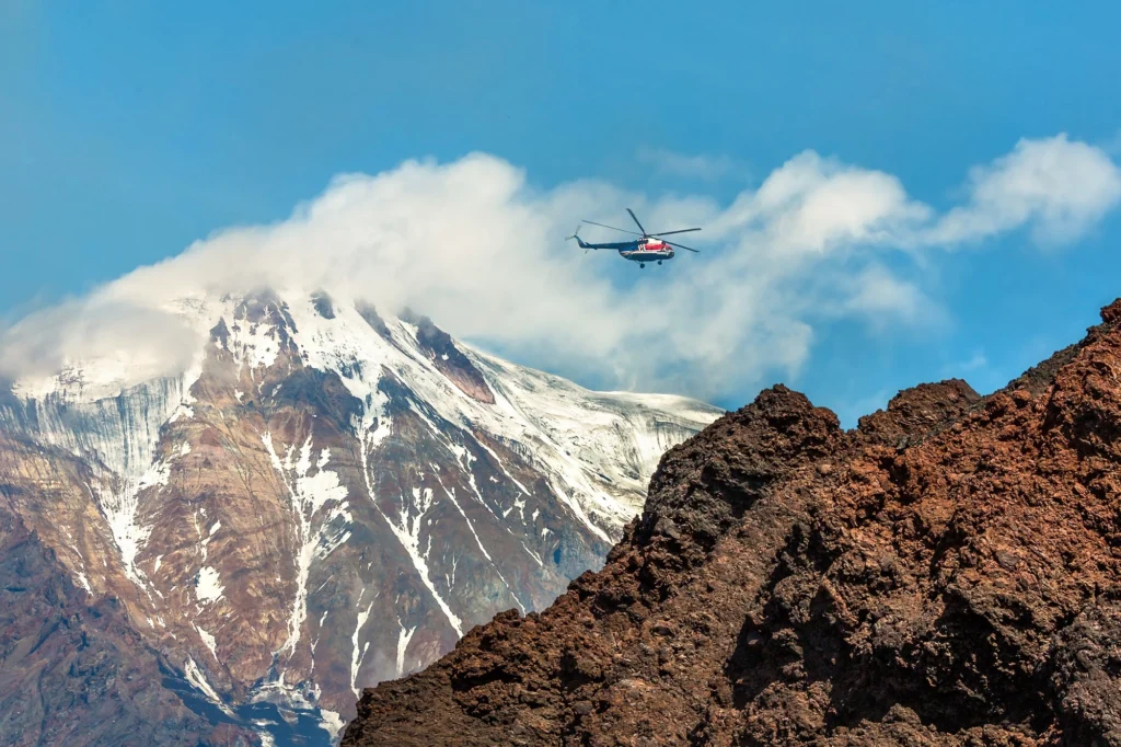 A helicopter flies in Kamchatka Russia A helicopter flies in Kamchatka, Russia