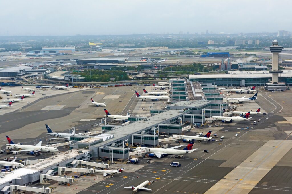 Aerial view of JFK airport terminal, tower and apron
