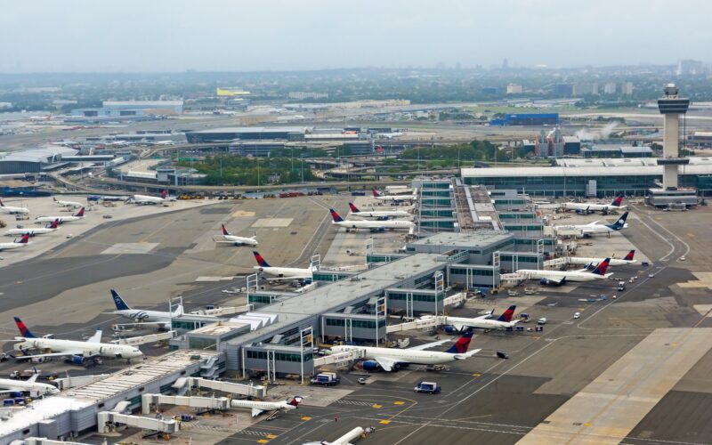 Aerial view of JFK airport terminal, tower and apron