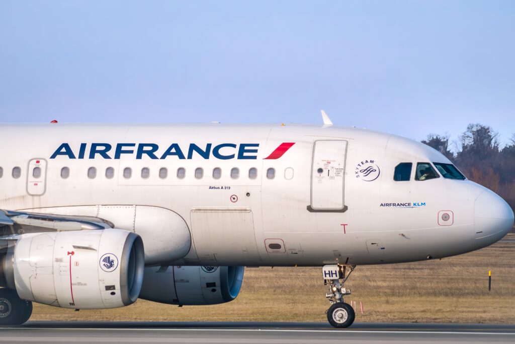  An Air France Airbus A319-111 (F-GRHH) airplane on the airport runway at Henri Coanda International Airport.