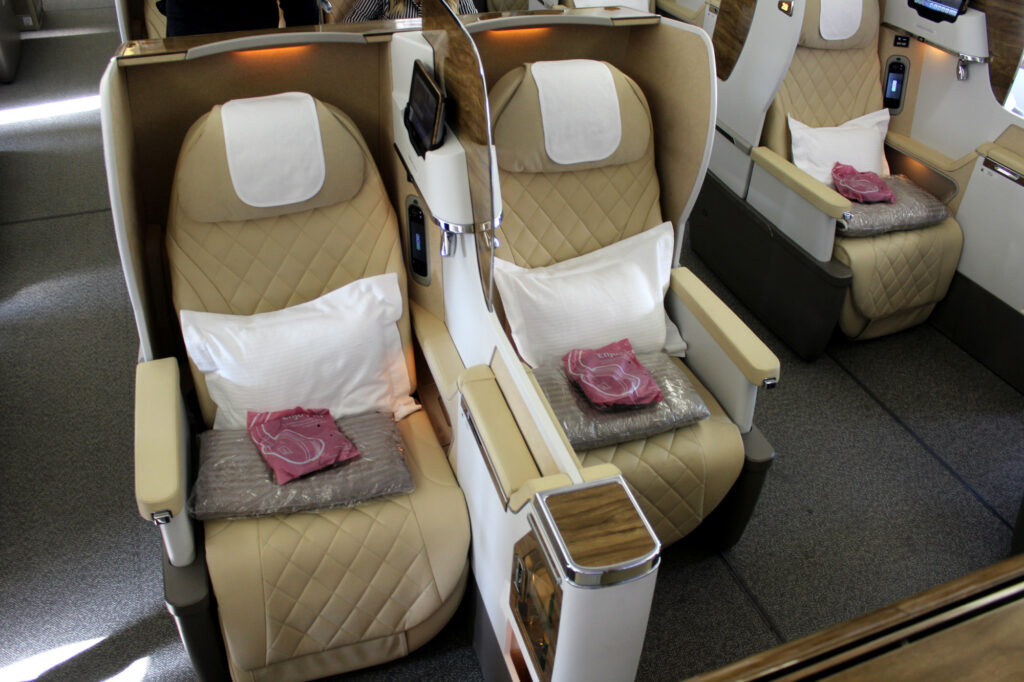 Emirates Airlines prepares to welcome passengers into its Boeing 777-200LR business class cabin.