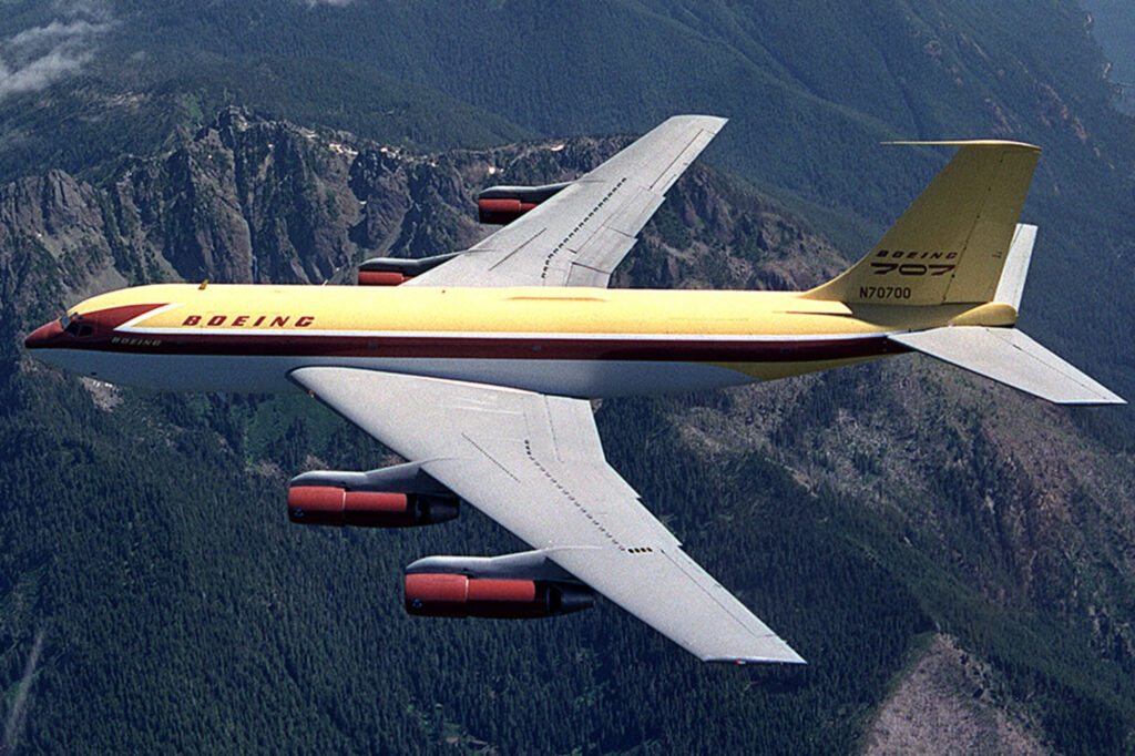 Dash 80 air-to-air photo, showing the aircraft passing over the Olympic Peninsula 
