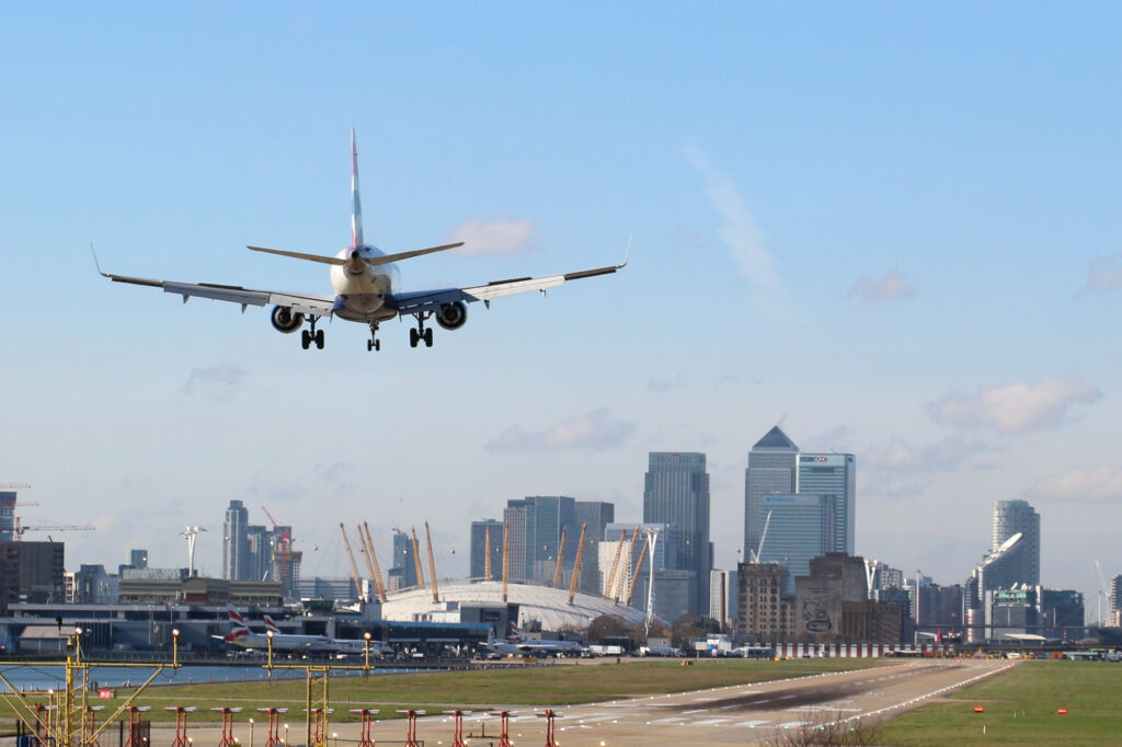 British Airways Plane landing at London's City Airport on a sunny day