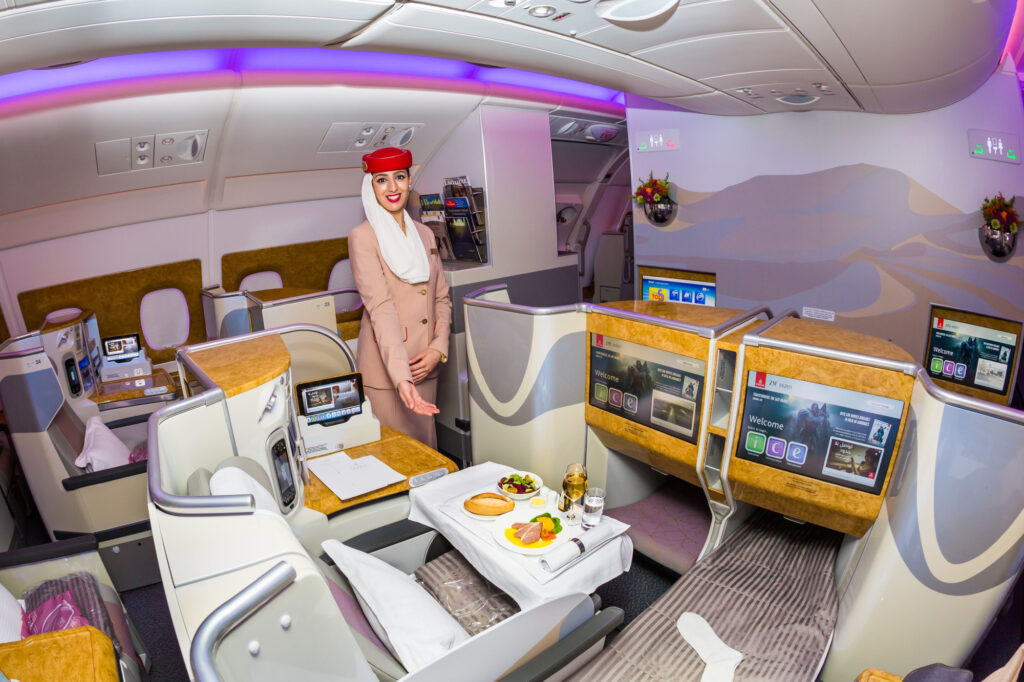 Emirates Airline flight attendant. Emirates business class. Airplane food. Stewardess dress. Flight attendant portrait. Emirates airline travel. Onboard dining.