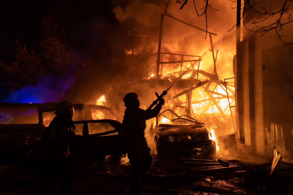 Emergency personnel work at the site of a drone strike in Ukraine