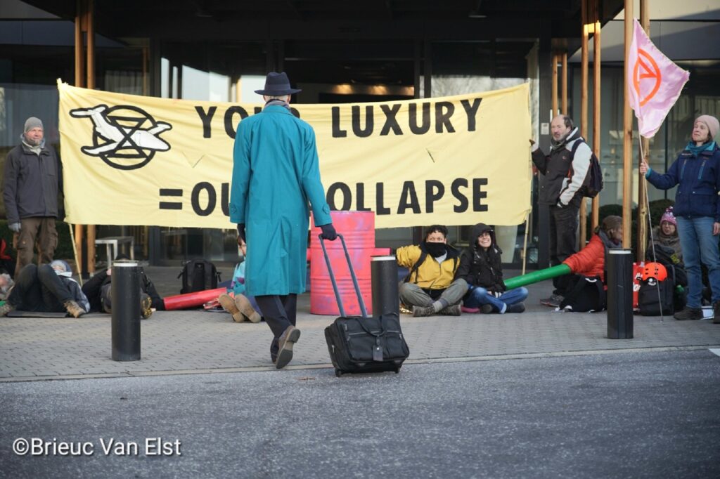 Protesters at Brussels Airport blockade the entrance to the private jet terminal