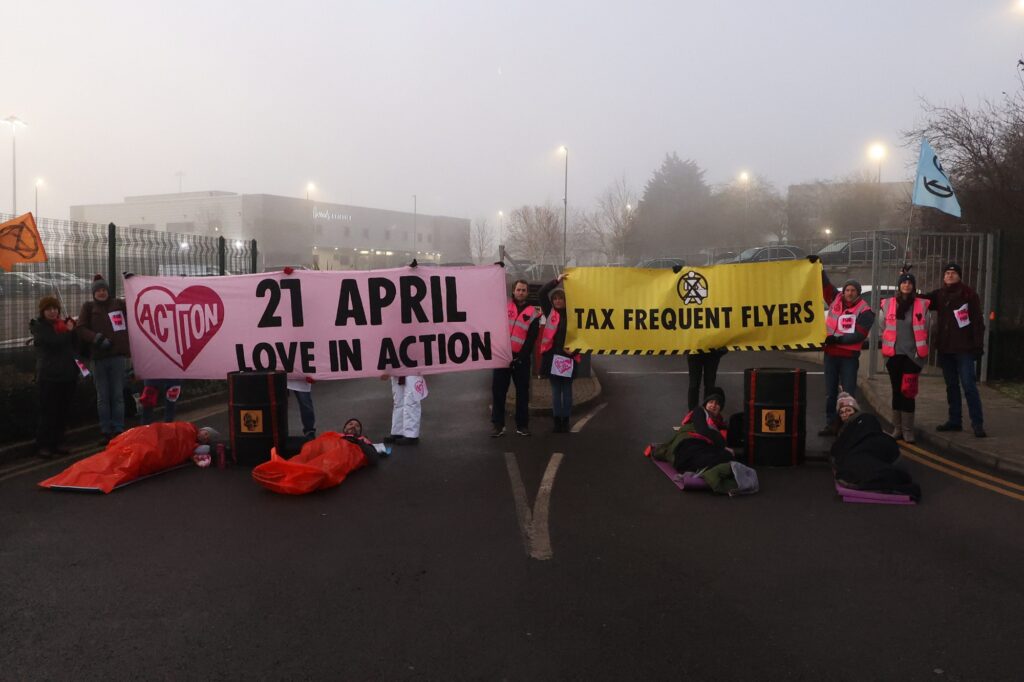 Extinction Rebellion UK protesters blockade entrance to private jet terminals at Luton Airport