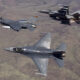 F-16 advanced fighter jet flying in formation with other F-16s and fighter jets