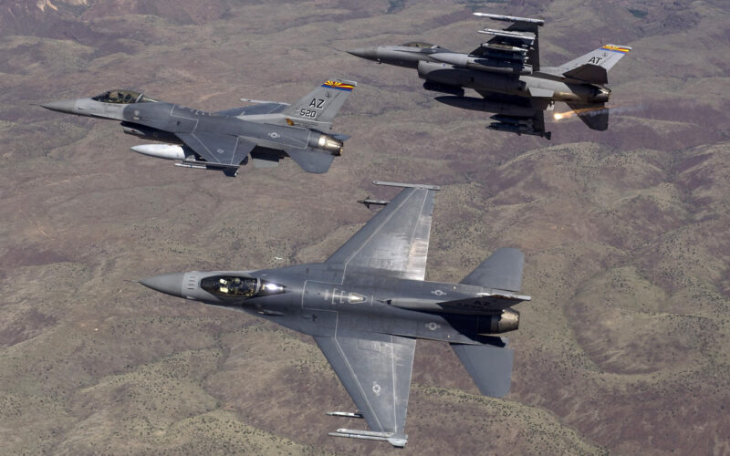 F-16 advanced fighter jet flying in formation with other F-16s and fighter jets