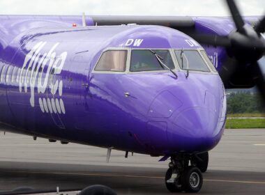 Flybe plane on the runway with pilot in the window