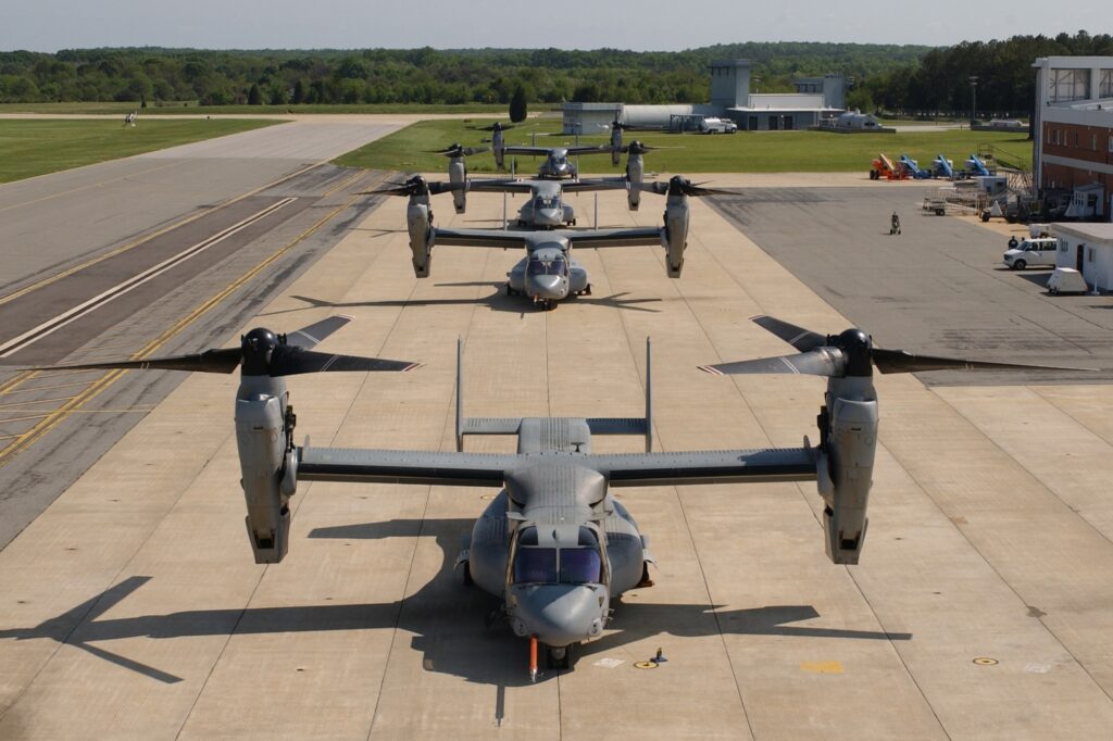 Four V-22 Osprey tiltrotor aircraft parked