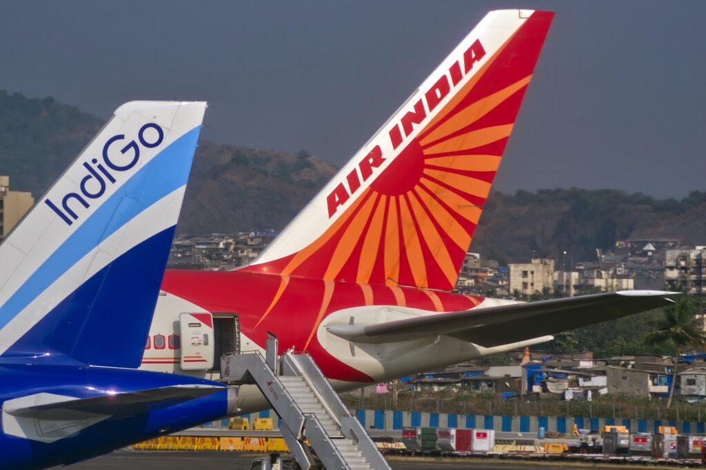 An Indigo A320 and Air India 777 parked at Sahar Mumbai International airport