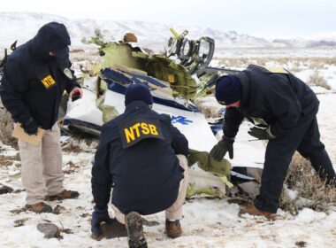 Investigators from National Transport Safety Board look over plane wreckage in Nevada after a Pilatus PC-12 airplane crashed
