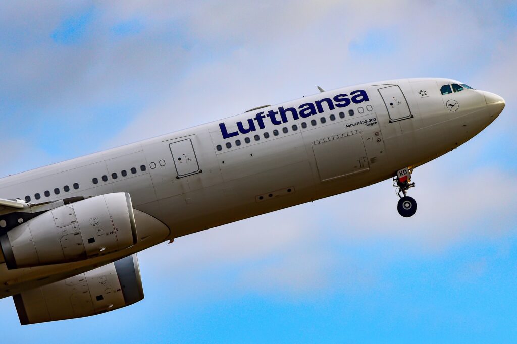 LUFTHANSA AIRLINES Airbus A330-300 over airport.