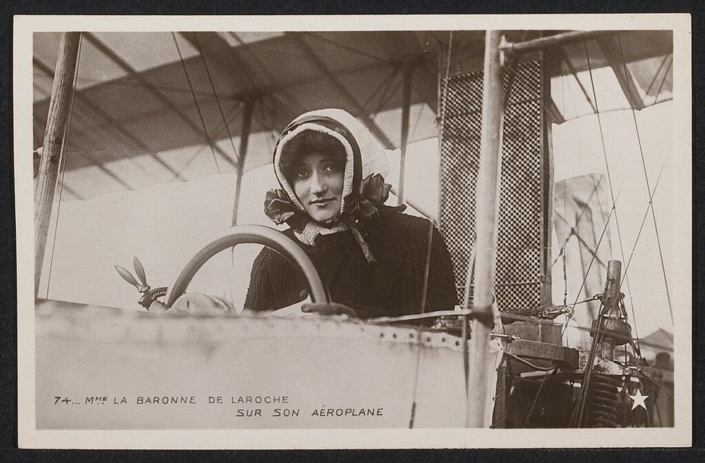 Raymonde-de-Laroche-piloting-an-aircraft.jpg