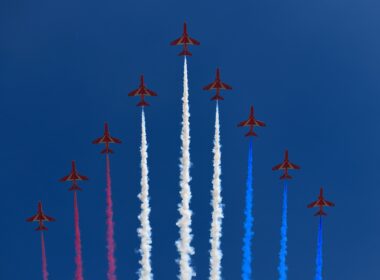 Formation of RAF Red Arrows with coloured trails on blue sky for flypast at Trooping the Colour for Queen Elizabeth's 93rd birthday London, England - June 8, 2019