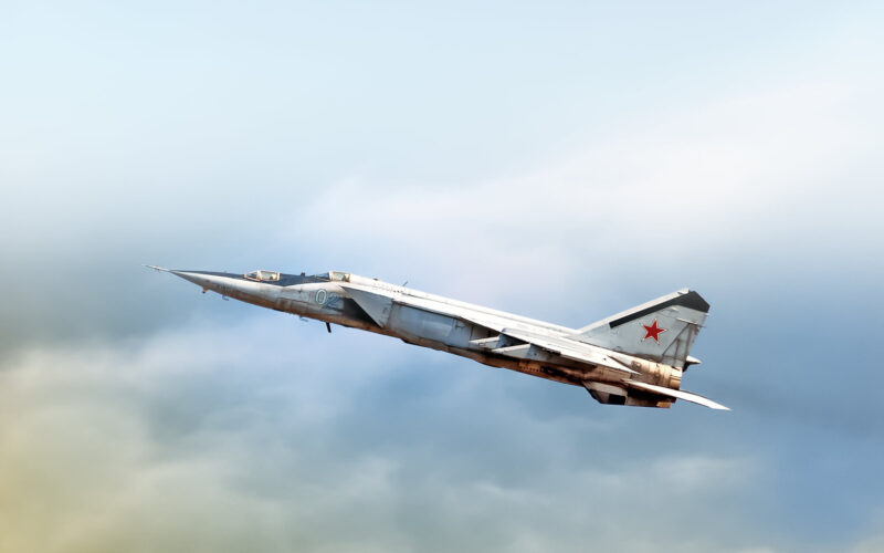 Russian air force Mig-25 foxbat supersonic military twin jet engine fighter interceptor aircraft warbird plane performing high speed pass aerial exterior view