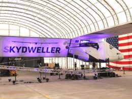 Skydweller aircraft in hangar during unveiling event.