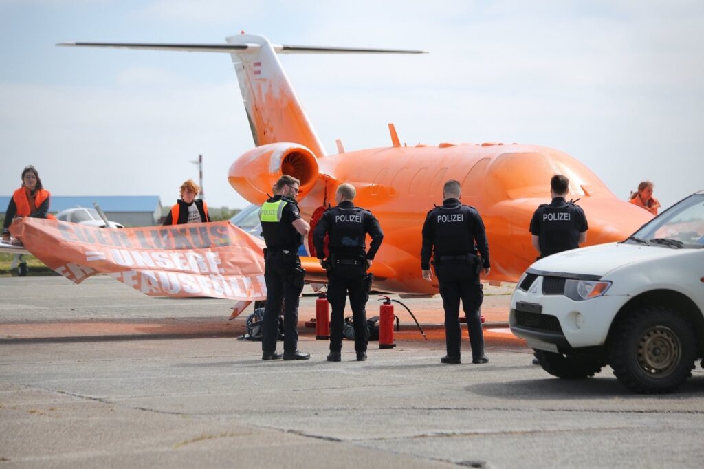 The Last Generation activists spray painted a private jet orange at an airport in Germany