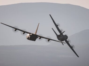 Two RAF C-130 Hercules flying in formation